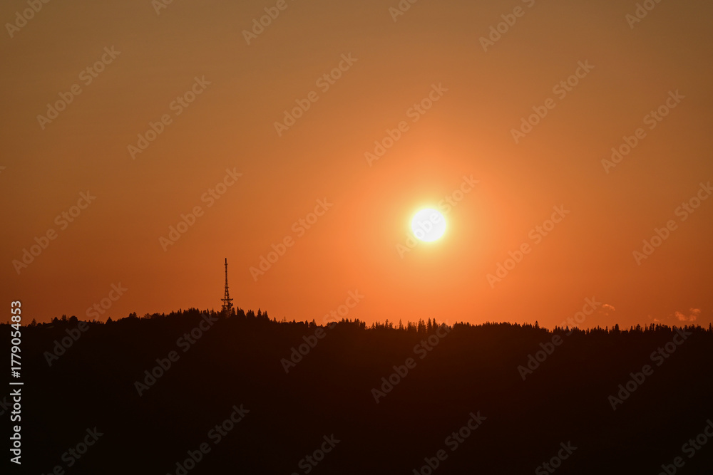 Fototapeta premium Scenic sunset over Gubalowka, Zakopane, Poland. View of the slope of Gubalowka with its characteristic tower - The Zakopane-Gubałowka transmitter, a facility for FM and TV transmission