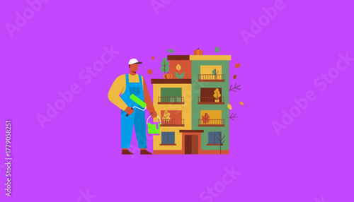 Maintenance worker painting a colorful apartment building during autumn renovation