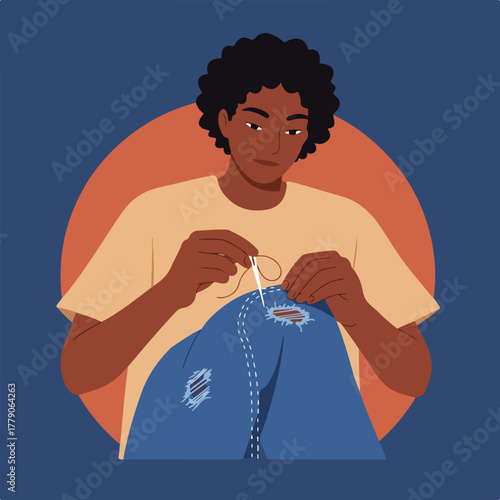 A person with dark skin sews with thread and needle on blue ripped jeans, orange & blue background