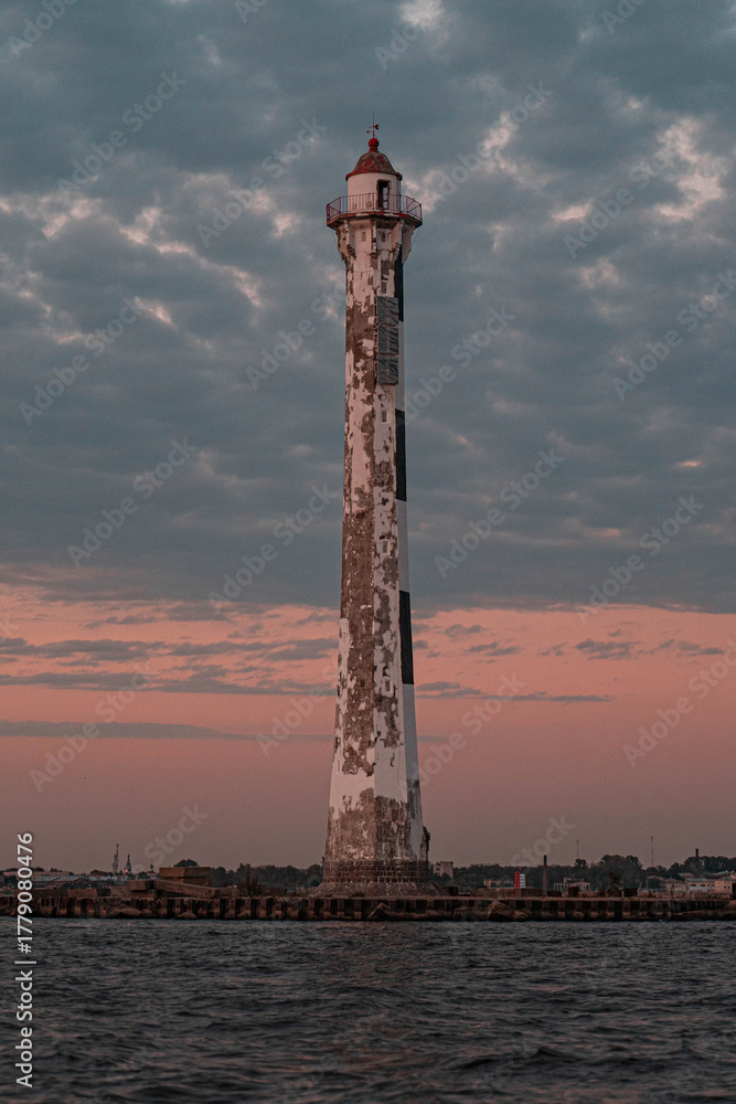Fototapeta premium Rear Lighthouse of the Sea Canal in Kronstadt at Sunset