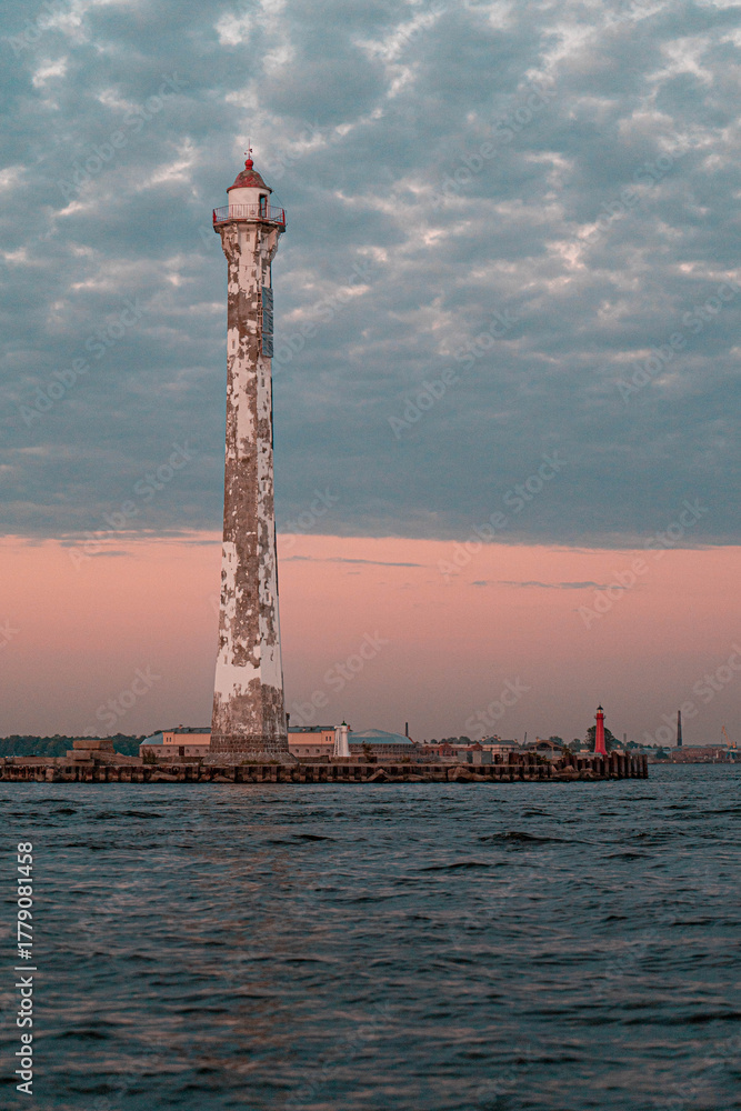 Fototapeta premium Rear Lighthouse of the Sea Canal in Kronstadt at Sunset