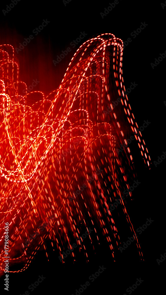 Fototapeta premium red dotted lines of lights on a black background