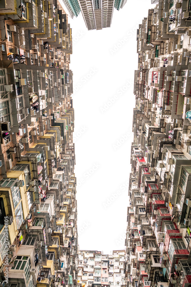 Obraz premium Yick Fat Building, Quarry Bay, Hong Kong. Residential area in old apartment with windows