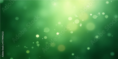 Bright green and blue defocused bokeh circles create a shiny abstract holiday background
