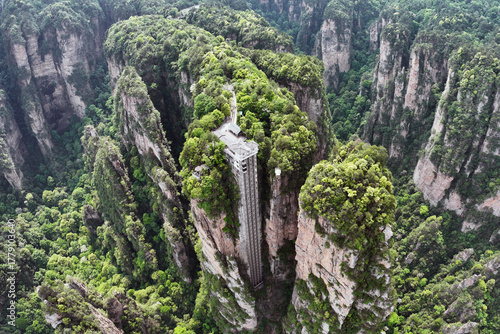 Aerial view of the Bailong Elevator rising dramatically through the towering sandstone pillars of Zhangjiajie National Forest Park, Hunan, China.