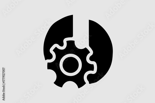 The image is a monochromatic graphic featuring a gear or cogwheel partially enclosed by a wrench or a similar tool. The central gear has teeth around its perimeter.