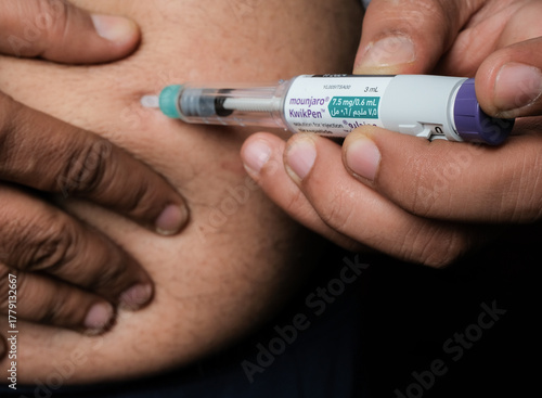 Basrah, Iraq - November 5, 2025: Subcutaneous Self-Injection of Tirzepatide (Mounjaro) Using a KwikPen Device