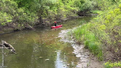 A man is rafting on a boat