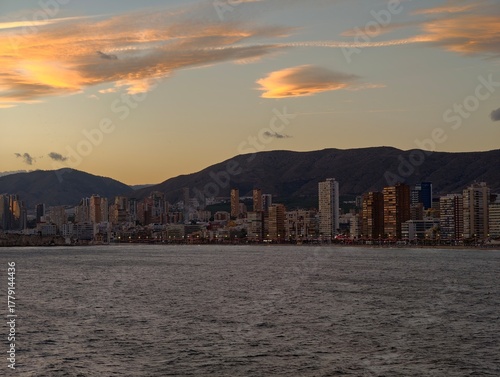 Εκτύπωση καμβά stunning seaside sunset, vivid twilight casting light over towering oceanfront s