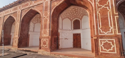 Architectural Symmetry and Detail: The Massive Red Sandstone Foundation and Geometric Design of Humayun's Tomb in Delhi, Showcasing Mughal Engineering