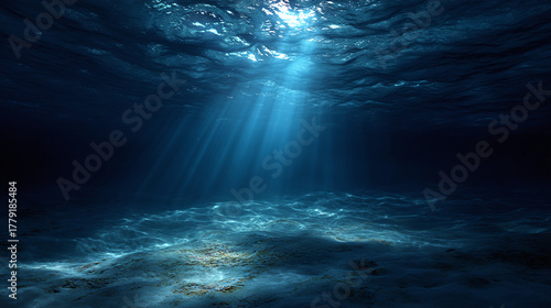 Captivating underwater scene, with sunlight filtering through the deep blue ocean water. The seabed is visible, creating a serene and mysterious atmosphere