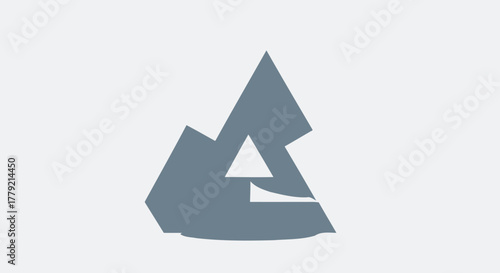Abstract geometric design with overlapping grey triangles and polygons, creating a modern, stylized mountain or architectural form.