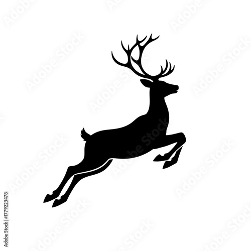 Majestic leaping stag with impressive antlers captured in a dynamic silhouette for festive holiday or wilderness themes
