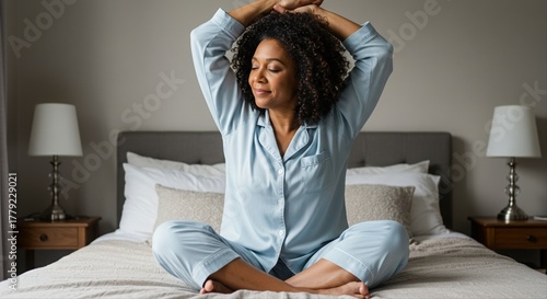 relaxed woman practicing morning yoga in cozy bedroom with neutral colors and peaceful mood