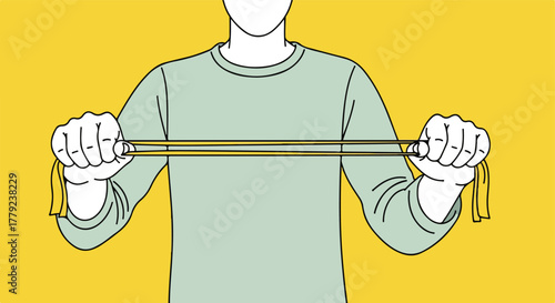 Person holding a yellow band