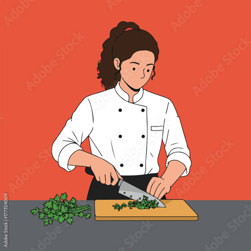 A female chef in uniform precisely chops herbs on a cutting board, with a red backdrop