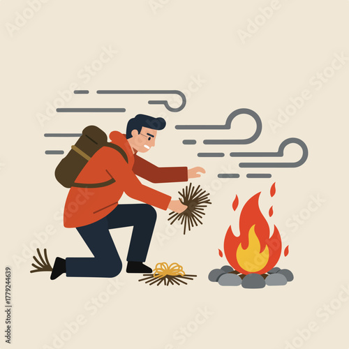 A person kneels, starting a fire with kindling. Wind blows nearby. The fire is built among rocks
