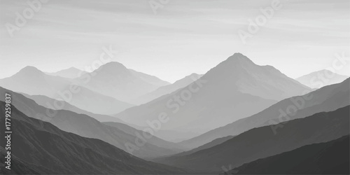 Majestic mountain landscape blanketed in snow beneath a blue sky, offering a serene view of peaks, clouds, and the distant horizon