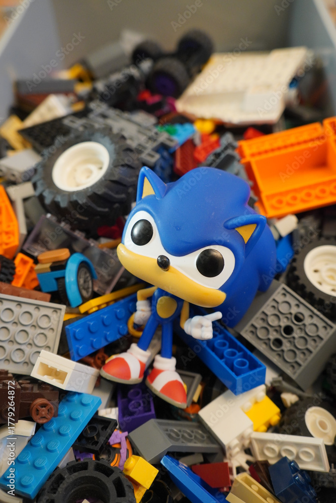 Naklejka premium Sonic the Hedgehog Funko Pop figure surrounded by colorful toy bricks