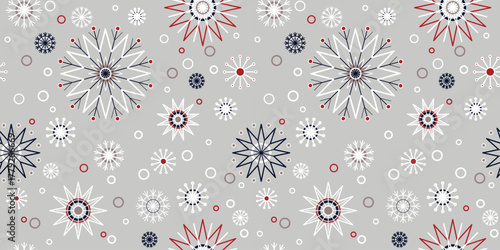 Christmas seamless pattern with snowflakes. Winter background classic style in traditional colors. Snowfall on grey background. Christmas mood pattern