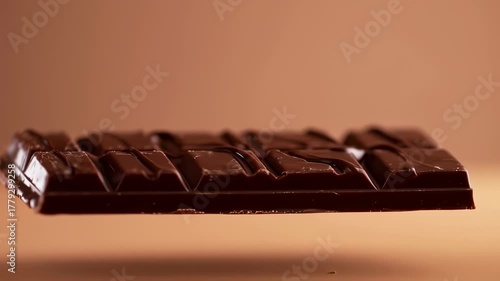 Dark chocolate bar, squares, glossy