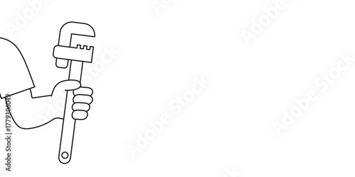 Person holding a wrench, ready to fix plumbing problems.