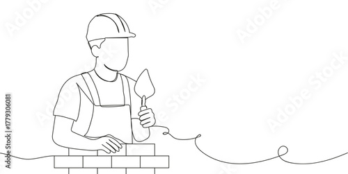 Hand holds a wrench, ready for plumbing tasks.