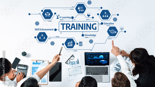 A dynamic training session showcasing e-learning methods and skill enhancement strategies, emphasizing teamwork and effective knowledge sharing in a modern workplace setting. Amity