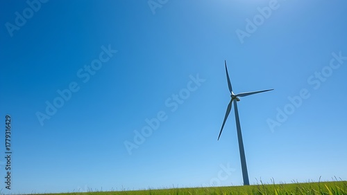rotor. Wind turbine in green field against blue sky representing clean energy, ESG reports, sustainability campaigns, designed for environmental awareness campaigns, promotes sustainability.