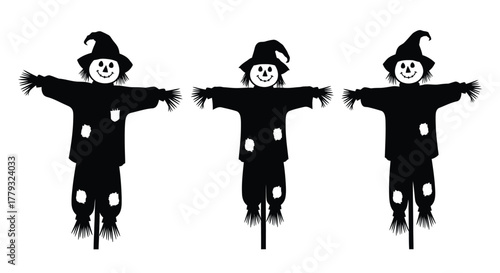 Three scarecrows in a row isolated on white background