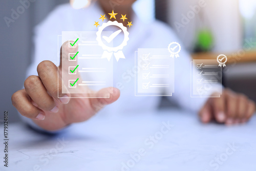 a man pointing on virtual document to approve certification with check mark on the certificate system that has certified to a quality standard passed audit in industry standards