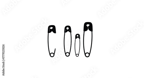 Four safety pins isolated on white background in different sizes