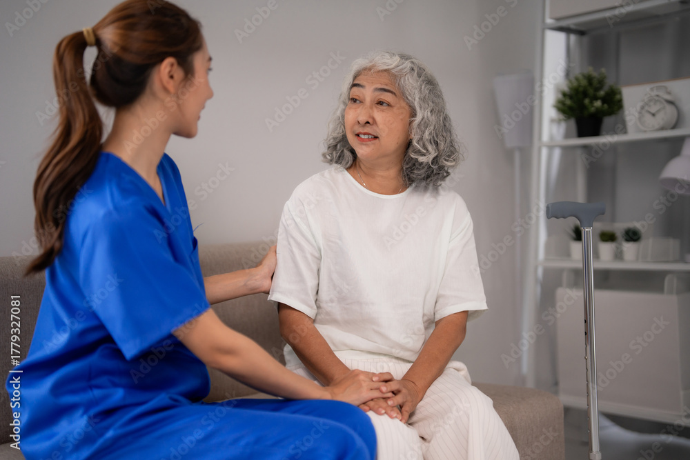 Obraz premium Asian Caregiver Comforting Senior Woman Home Support Elderly Assistance Healthcare Empathy Conversation Indoor Setting