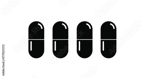 Four black capsule pills isolated on white background for medical use