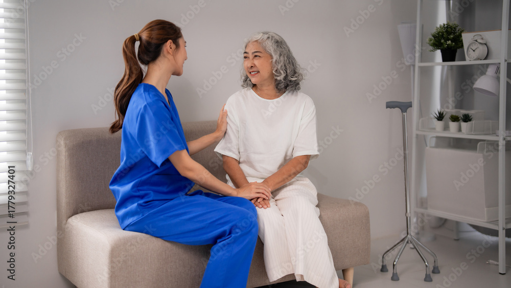Obraz premium Asian Nurse Provides Compassionate Home Care to Senior Woman Empathy Support Companionship for Elderly Wellness