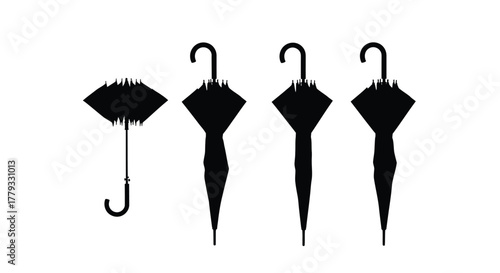 Four black umbrellas are standing up isolated on white background