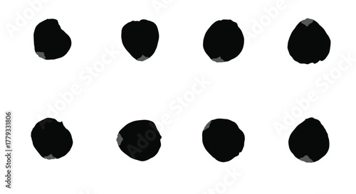 Eight black ink blots isolated on white background for artistic purposes