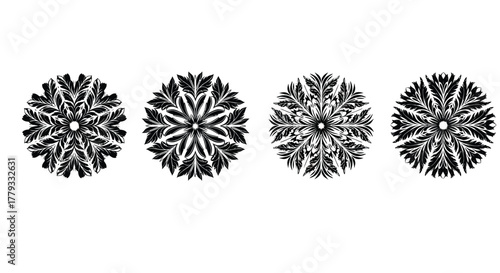 Four black floral patterns isolated on white background, exhibiting symmetry