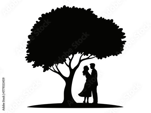 A silhouette of a couple embracing under a large tree