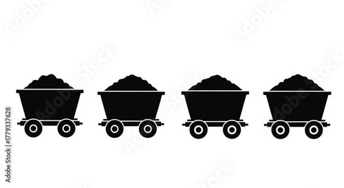 Four coal mine carts filled with coal isolated on white background