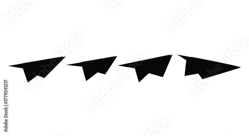 Four paper airplanes in a row isolated on white background