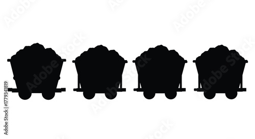 Four coal mine carts filled with coal isolated on white background
