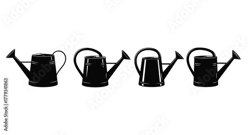 Four watering cans in a row isolated on white background