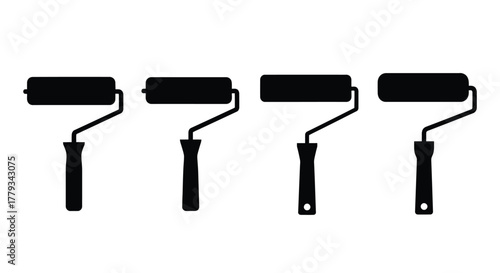 Four black paint rollers in a row isolated on white background