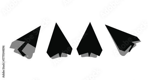 Four black paper airplanes isolated on white background, ready to fly away