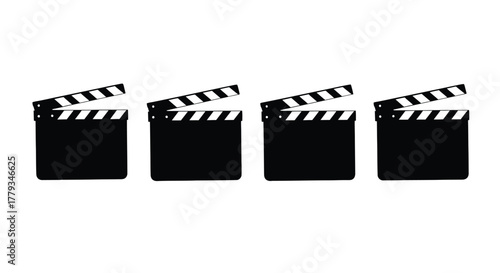 Four black clapperboards isolated on white background, film industry concept