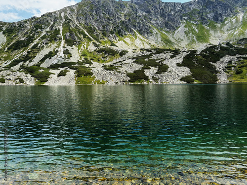 Fototapeta Naklejka Na Ścianę i Meble -  Tranquil mountain lake in Zakopane Poland with clear water and rocky alpine shoreline