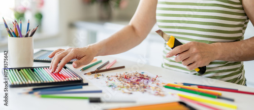 Woman Sharpening Colored Pencils