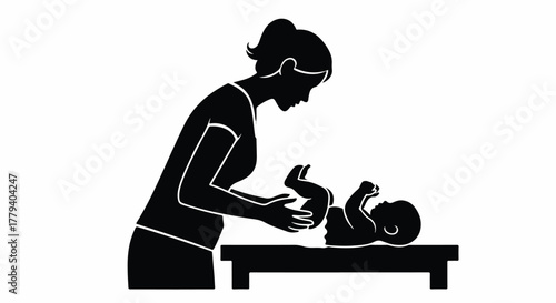 A silhouette of a mother changing her baby's diaper on a changing table