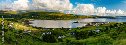 Isle of Skye, Scotland, Uk: aerial view of the sheltered bay of Uig (Snizort) on the northern coast of the Trotternish peninsula, with the port and the ferries departing for the Outer Hebrides